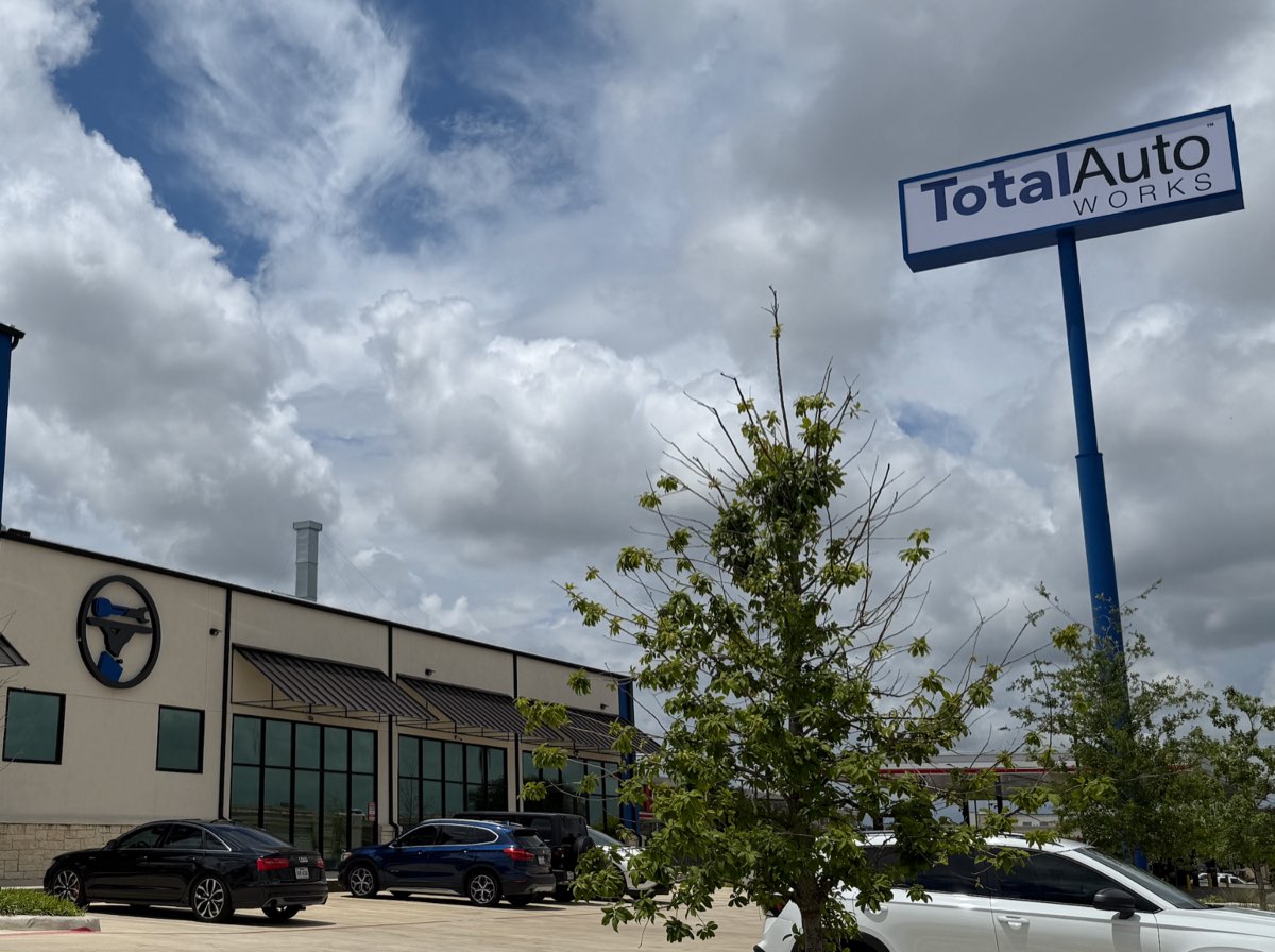 Exterior of the Total Auto Works building and sign in Austin, Texas
